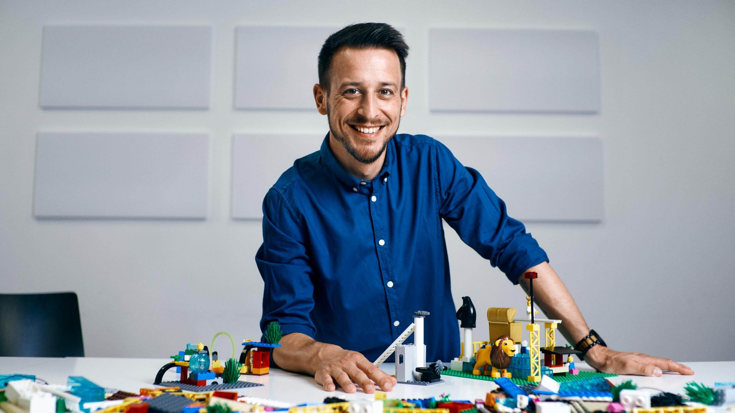 Sven Golob at table with Lego
